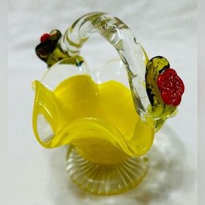 Vintage hand blown mini glass basket with twisted handle. Yellow, red & clear.